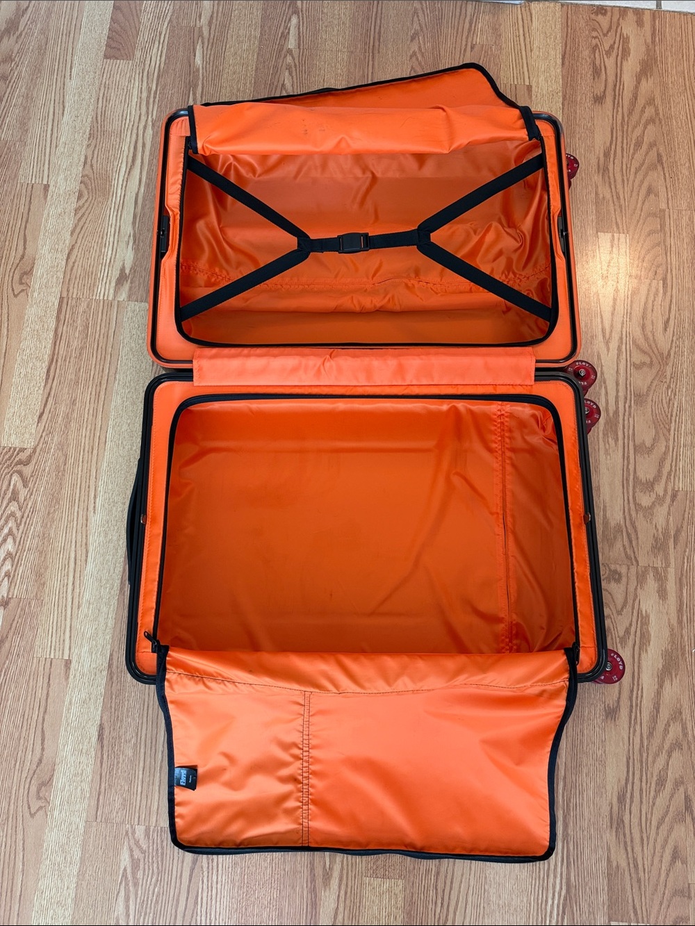Floyd Brown Hardshell Suitcase with Bright Orange Interior and Red Wheels - Picture 11 of 17